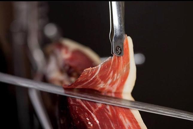 The Luxurious World of Jamón Ibérico de Bellota: Unveiling Its Rich History and Unmatched Quality